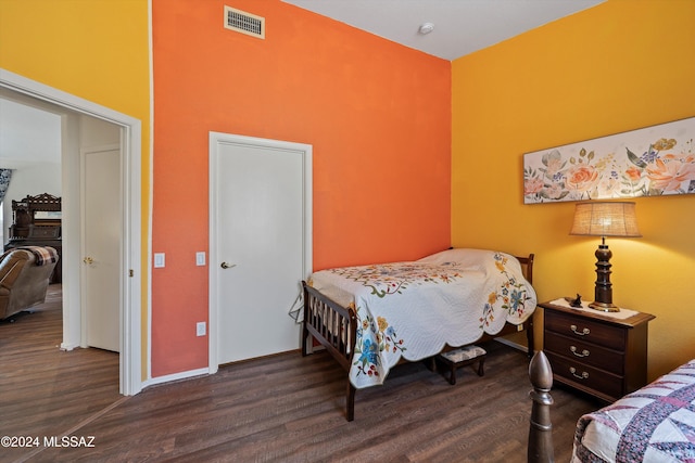 bedroom featuring dark wood-type flooring