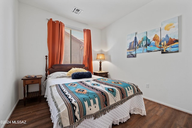 bedroom featuring dark hardwood / wood-style floors