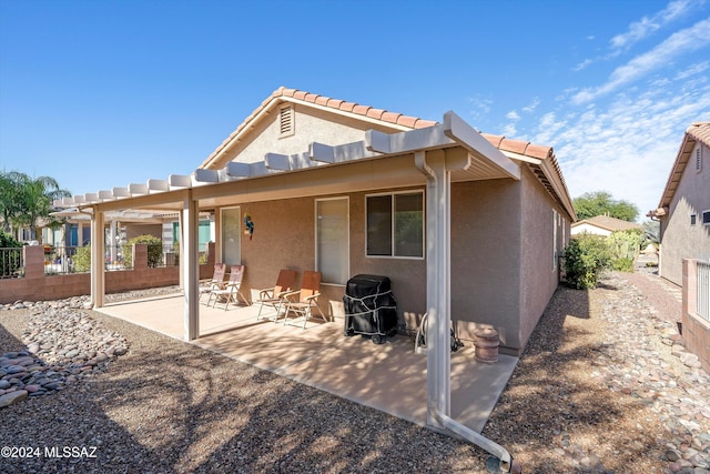 rear view of property with a patio area