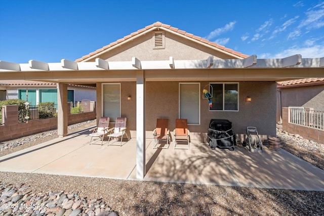 back of house featuring a patio area