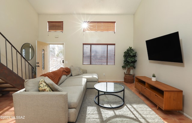 living room with a high ceiling