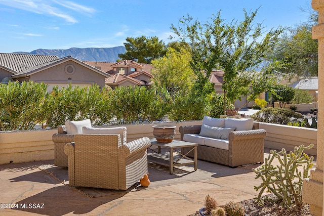 view of patio featuring outdoor lounge area and a mountain view