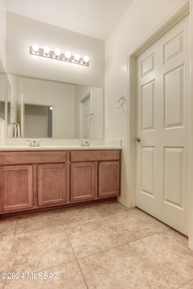 bathroom with tile patterned flooring and vanity