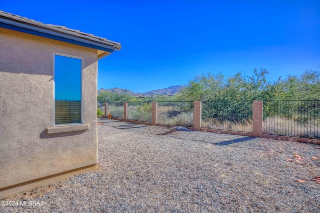 view of gate with a mountain view