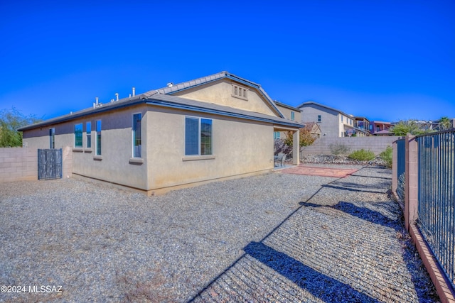 rear view of house with a patio area