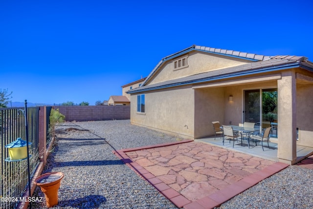 back of property with a patio area