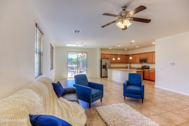 tiled living room featuring ceiling fan