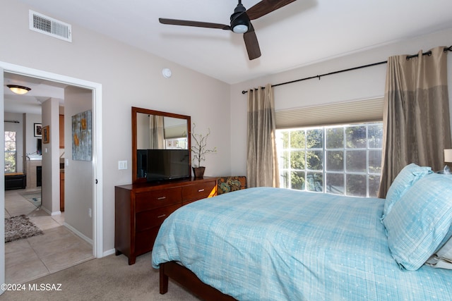 carpeted bedroom featuring ceiling fan