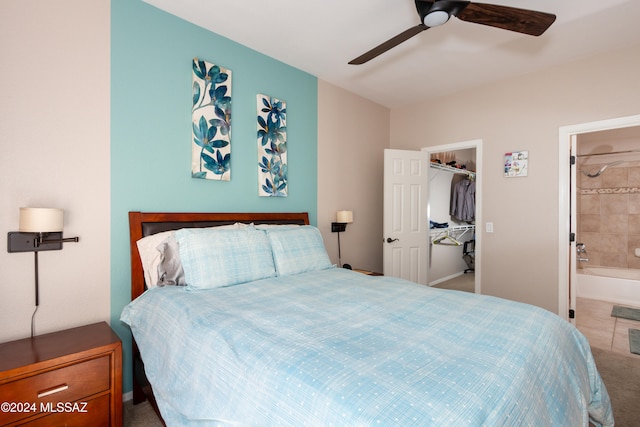 bedroom featuring ceiling fan, a closet, connected bathroom, and a spacious closet