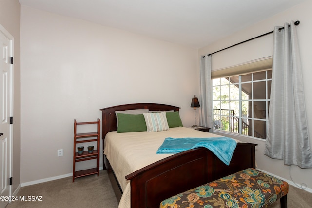 bedroom with light colored carpet