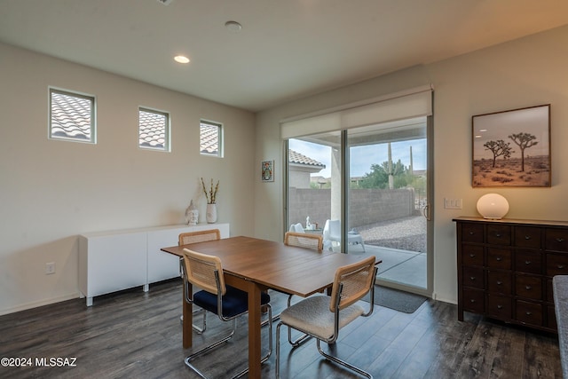 dining area with dark wood-type flooring, baseboards, and recessed lighting