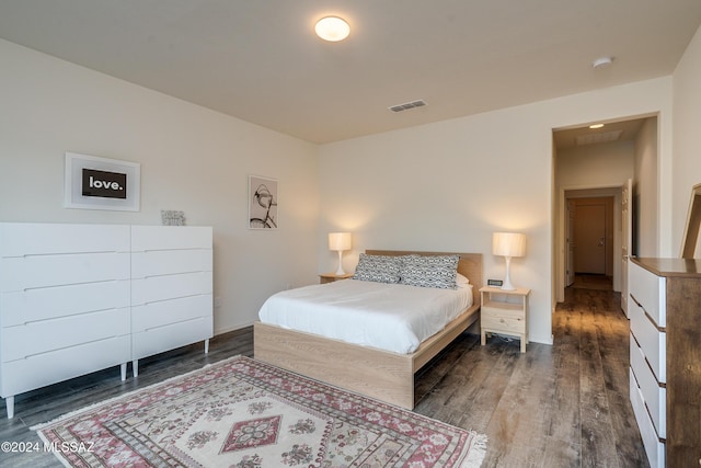 bedroom with wood finished floors and visible vents