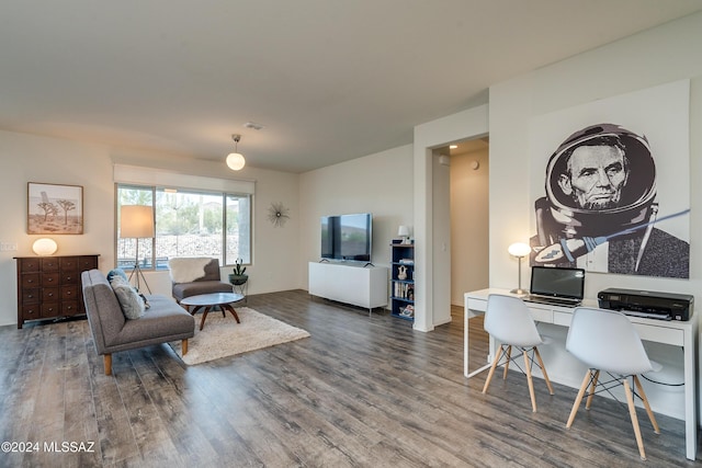 living room with visible vents and wood finished floors
