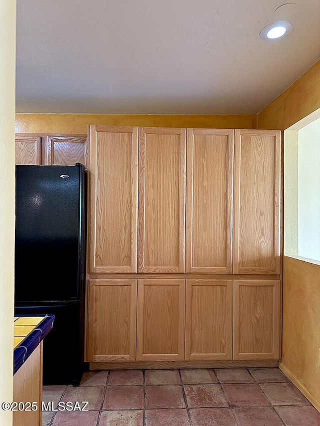 8034 E Shadow Ln, Tucson, AZ 85750 - kitchen with freestanding refrigerator and light brown cabinetry