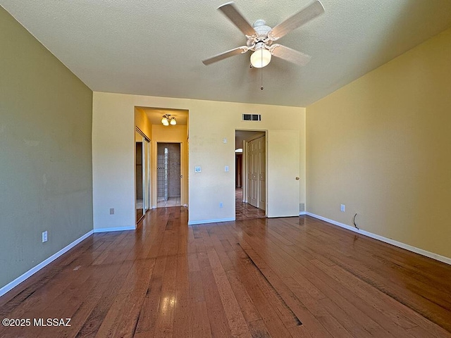 8034 E Shadow Ln, Tucson, AZ 85750 - unfurnished room featuring hardwood / wood-style floors, a ceiling fan, baseboards, and a textured ceiling