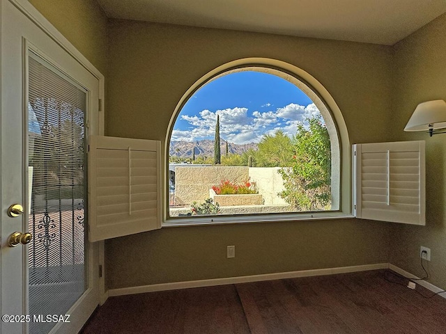8034 E Shadow Ln, Tucson, AZ 85750 - spare room with healthy amount of natural light and baseboards