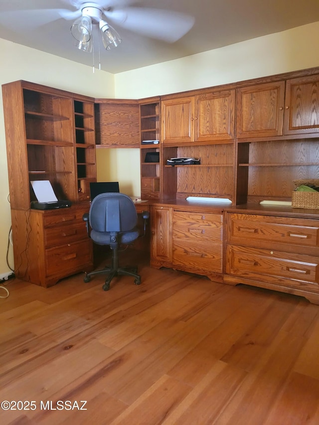 office area featuring light hardwood / wood-style flooring and ceiling fan