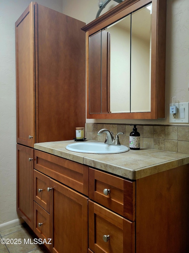 bathroom with vanity and tile patterned floors