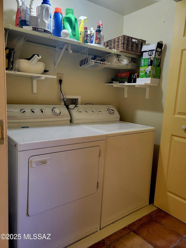 clothes washing area with washer and dryer and tile patterned floors