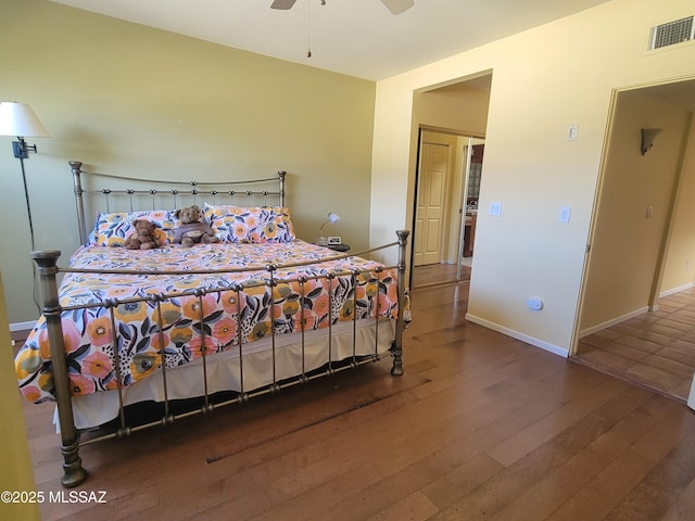 bedroom with dark wood-type flooring and ceiling fan