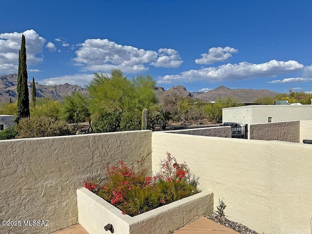 8034 E Shadow Ln, Tucson, AZ 85750 - view of patio featuring a mountain view and fence