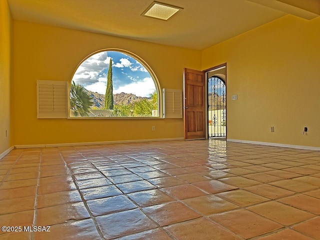 8034 E Shadow Ln, Tucson, AZ 85750 - unfurnished room with plenty of natural light and baseboards