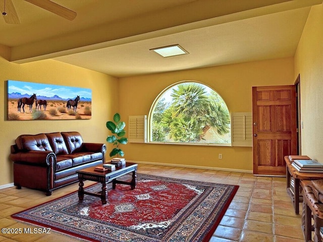 8034 E Shadow Ln, Tucson, AZ 85750 - living room with baseboards and a ceiling fan
