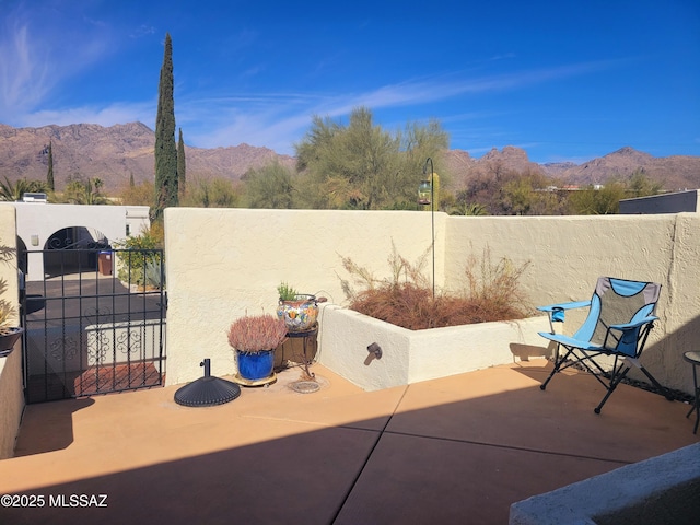 view of patio / terrace with a mountain view