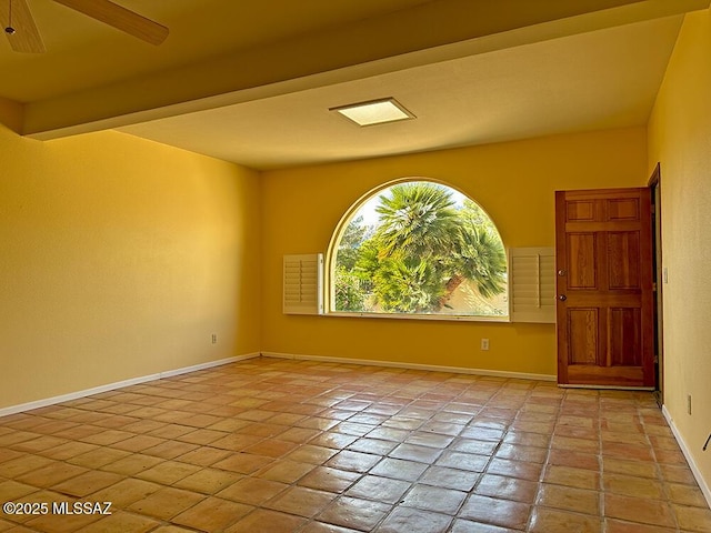 8034 E Shadow Ln, Tucson, AZ 85750 - empty room featuring ceiling fan, baseboards, and light tile patterned floors