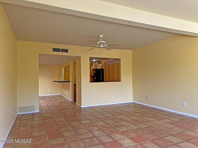 8034 E Shadow Ln, Tucson, AZ 85750 - spare room featuring ceiling fan and baseboards