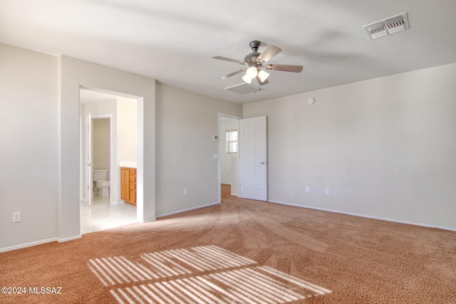 empty room featuring light carpet and ceiling fan