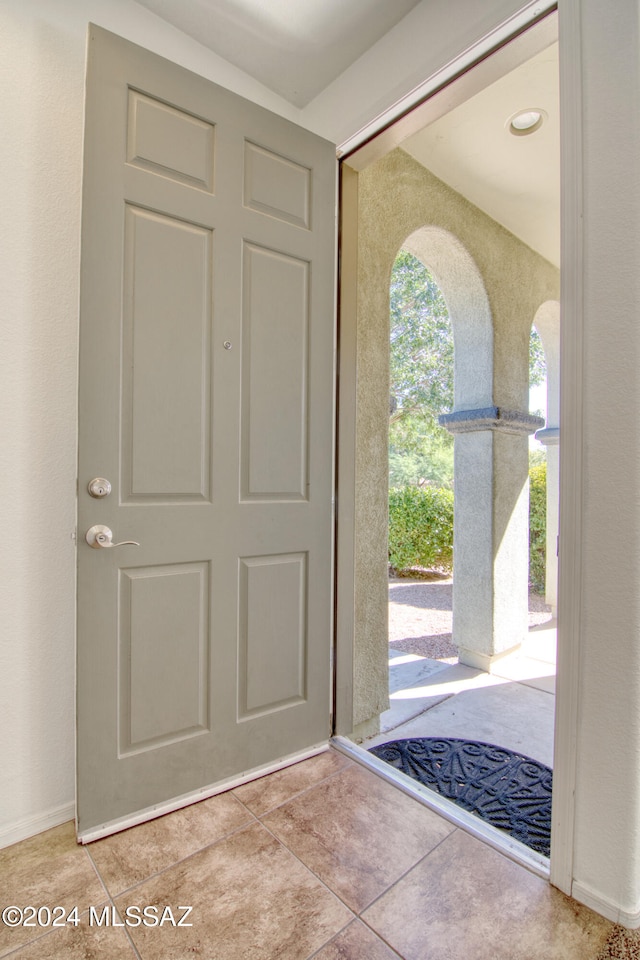 entrance foyer with light tile patterned flooring