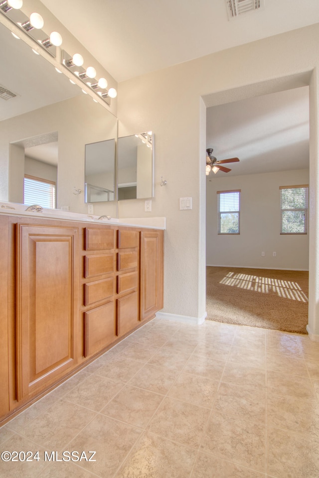 bathroom with vanity, tile patterned floors, plenty of natural light, and ceiling fan