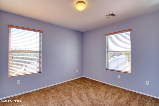 unfurnished room featuring carpet floors