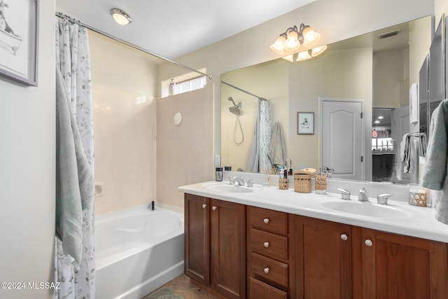 bathroom featuring tile patterned floors, vanity, and shower / tub combo