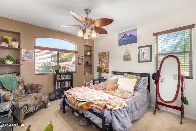 bedroom featuring ceiling fan and light colored carpet