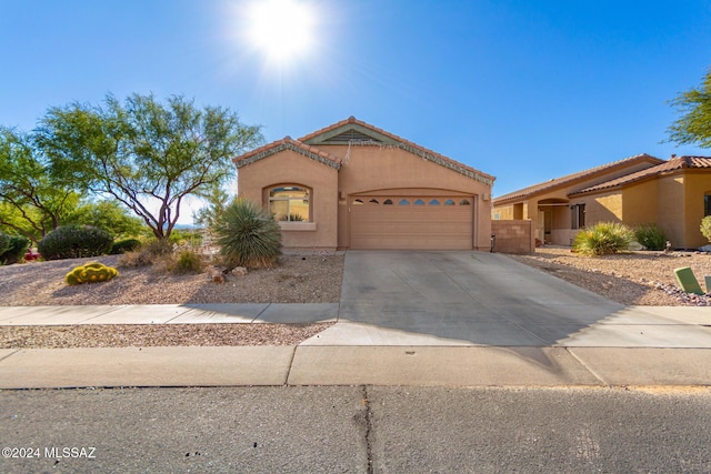 13696 E Aviara Pl, Vail, AZ 85641 - mediterranean / spanish house with a garage, a tiled roof, stucco siding, and driveway