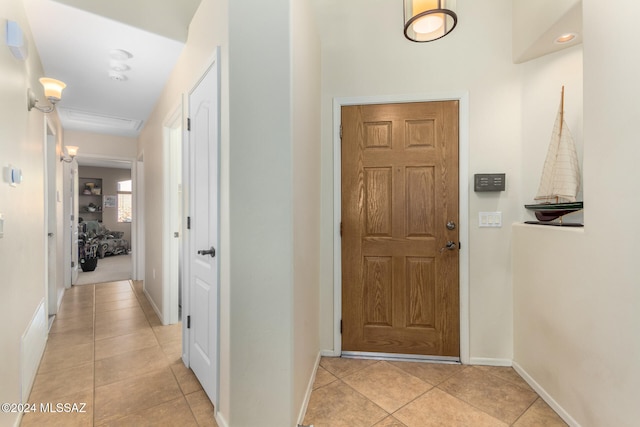 foyer featuring light tile patterned floors