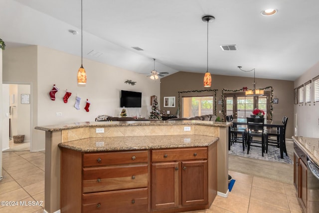 13696 E Aviara Pl, Vail, AZ 85641 - kitchen with lofted ceiling, light tile patterned floors, brown cabinets, open floor plan, and pendant lighting
