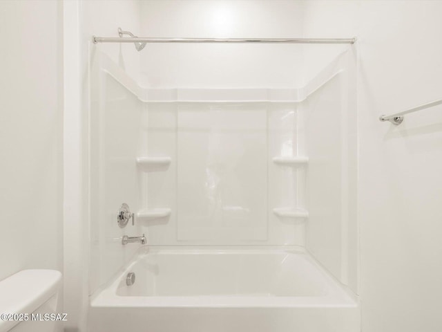 full bathroom featuring toilet