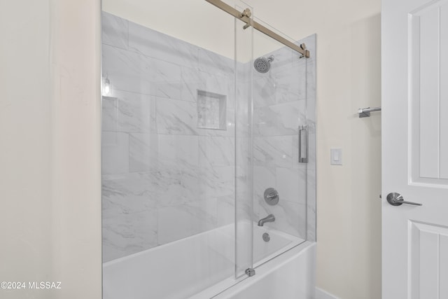 bathroom featuring shower / bath combination with glass door