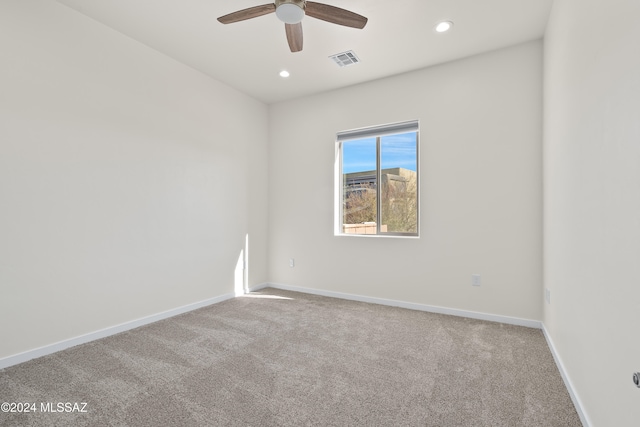 carpeted empty room with ceiling fan