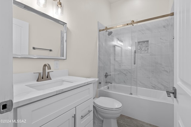 full bathroom with tile patterned flooring, vanity, toilet, and shower / bath combination with glass door