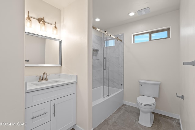 full bathroom with vanity, toilet, and bath / shower combo with glass door