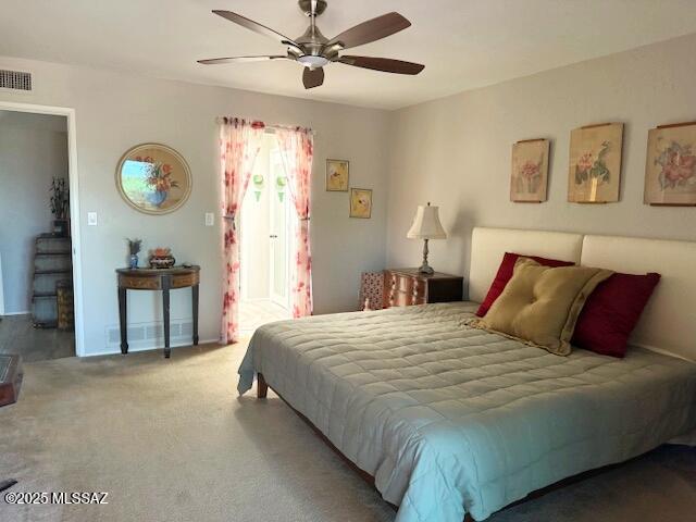 611 S Los Opalos, Green Valley, AZ 85614 - carpeted bedroom featuring a ceiling fan and baseboards