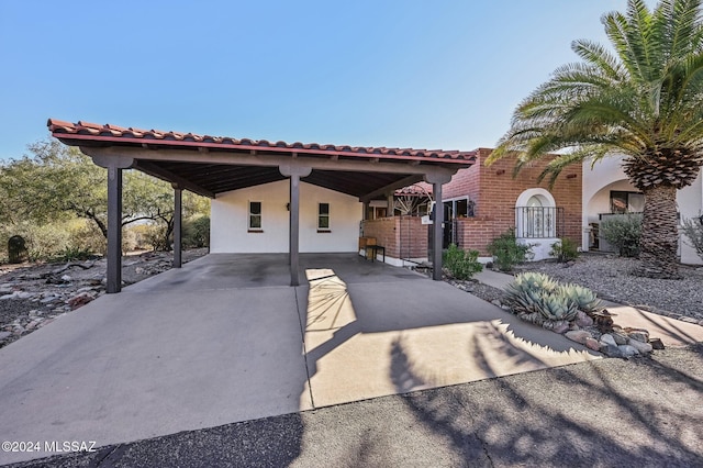 mediterranean / spanish-style home featuring a carport