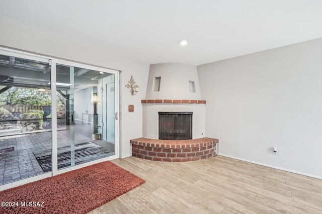 611 S Los Opalos, Green Valley, AZ 85614 - living area with wood finished floors, a fireplace, and baseboards