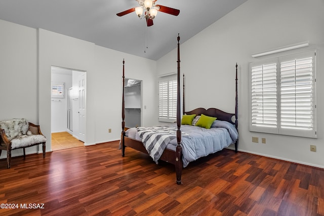 bedroom featuring a walk in closet, high vaulted ceiling, ceiling fan, and dark wood-type flooring