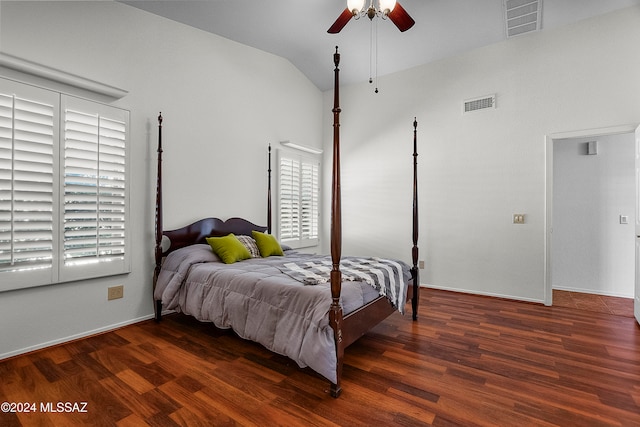 bedroom with ceiling fan, dark hardwood / wood-style floors, and vaulted ceiling