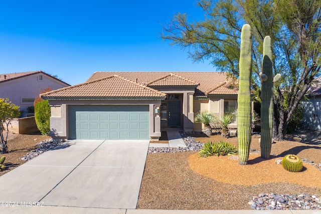 1955 E E Clf, Swallow Trail, Green Valley, AZ 85614 - view of front facade featuring stucco siding, a tile roof, and a garage